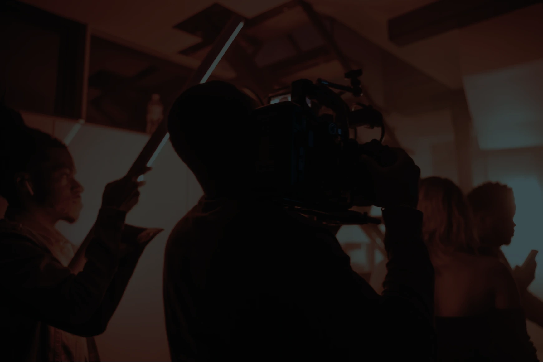 People working on a film set.